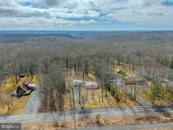 a view of a balcony with a floor to ceiling window and an outdoor space