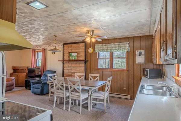 a view of a dining room with furniture window and outside view