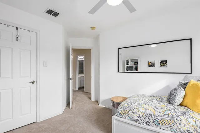 a bedroom with a bed and a couch