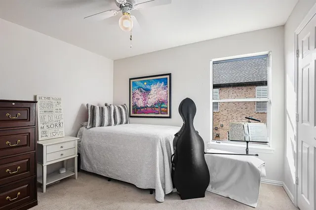 a bedroom with furniture and a window