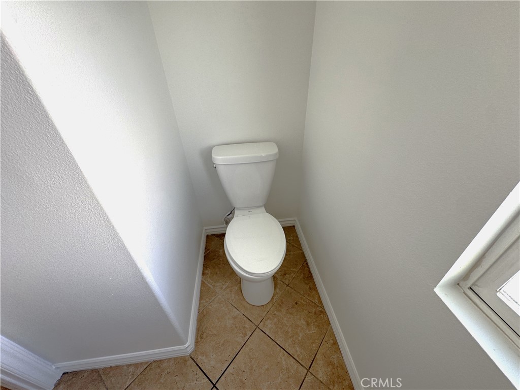 8240 Chamberlain Lane Reseda, CA 91335 - Photo 20 of 23 a white toilet sitting next to a small white wall