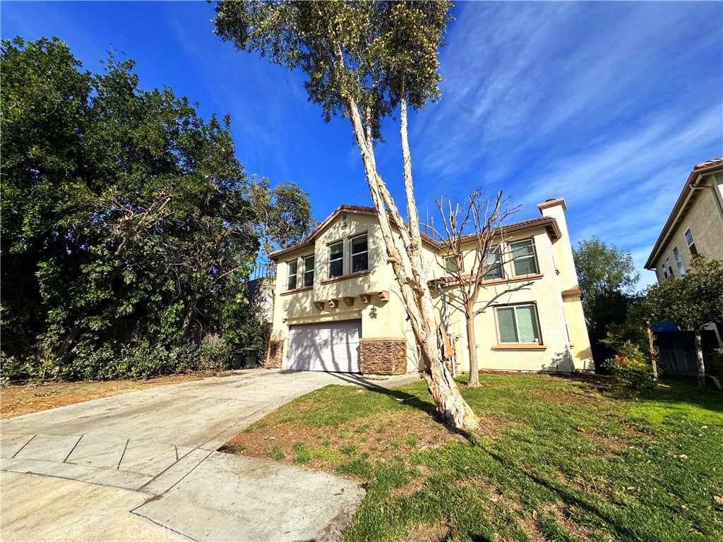 8240 Chamberlain Lane Reseda, CA 91335 - Photo 2 of 23 a view of a house with a yard