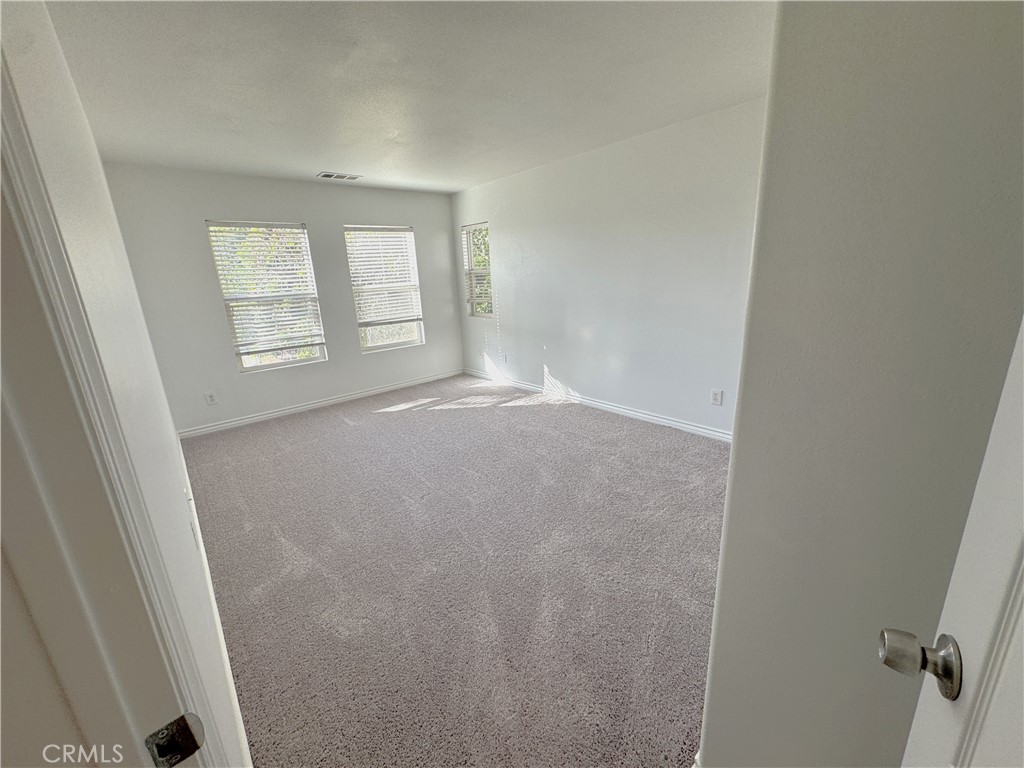 8240 Chamberlain Lane Reseda, CA 91335 - Photo 21 of 23 an empty room with windows