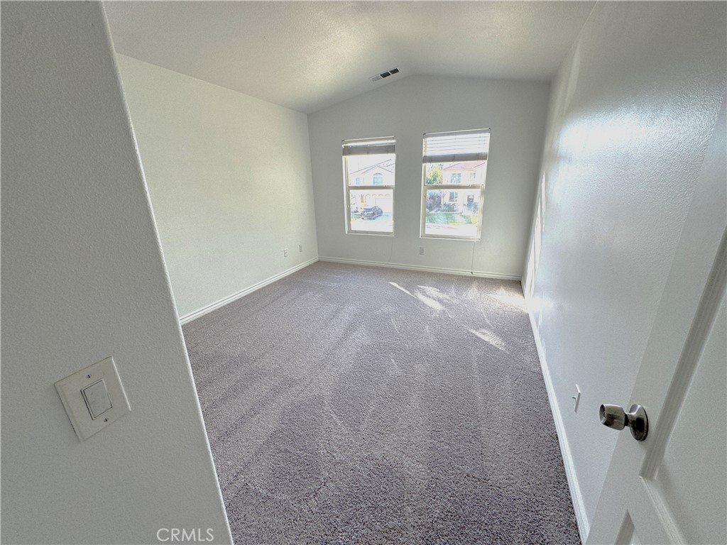 8240 Chamberlain Lane Reseda, CA 91335 - Photo 23 of 23 an empty room with windows and closet