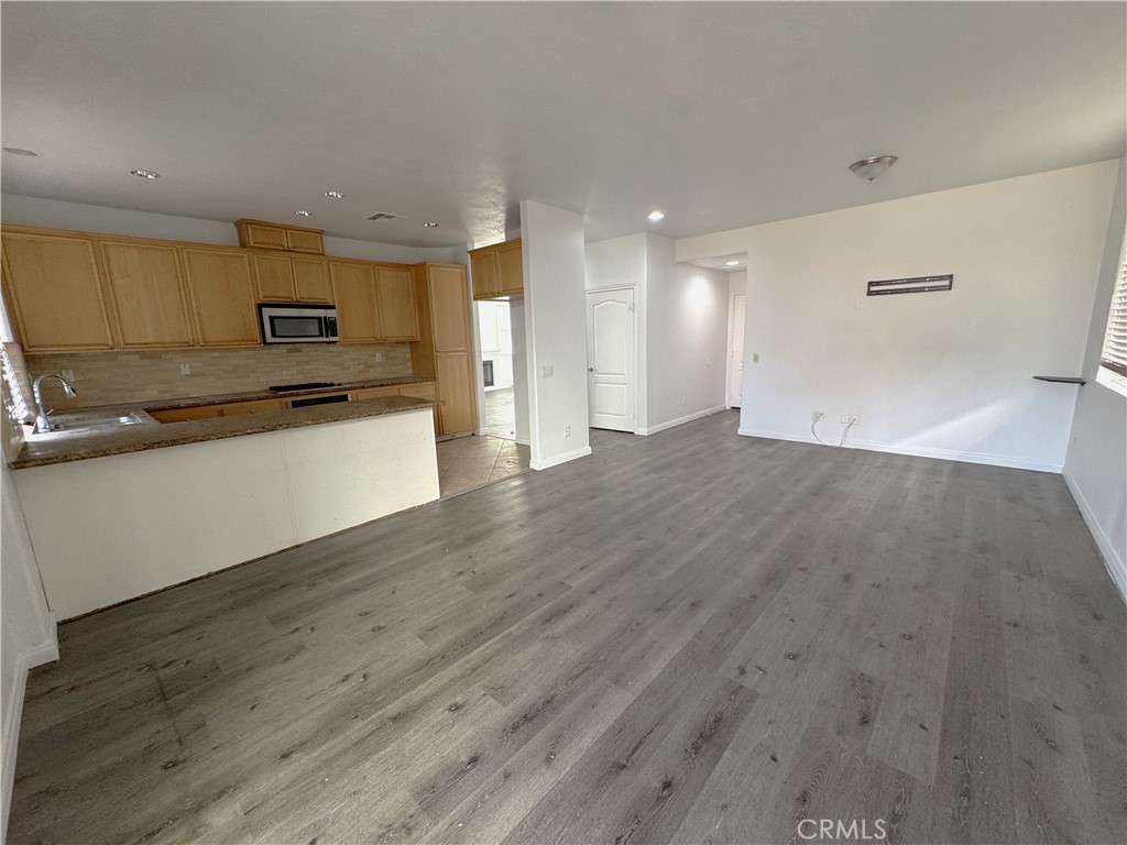 8240 Chamberlain Lane Reseda, CA 91335 - Photo 6 of 23 a view of kitchen with wooden floor