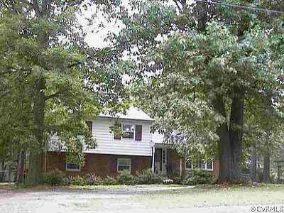 11421 Old Centralia Road Chester, VA 23831 - Photo 1 of 1 a house that has a tree in front of it
