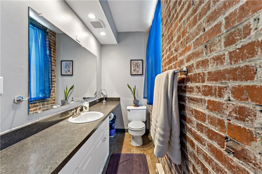 131 Beam Way Pittsburgh, PA 15211 - Photo 20 of 50 a bathroom with a granite countertop sink and a mirror