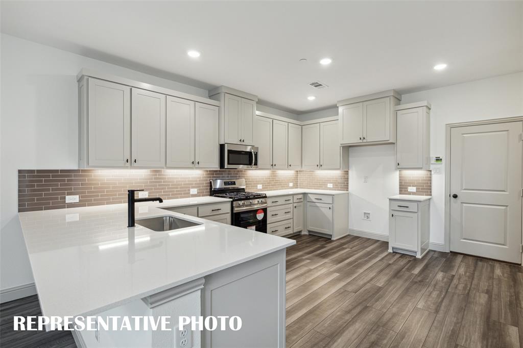 220 Dylan Way Midlothian, TX 76065 - Photo 4 of 16 No shortage of space, storage or style in this dream kitchen! REPRESENTATIVE PHOTO