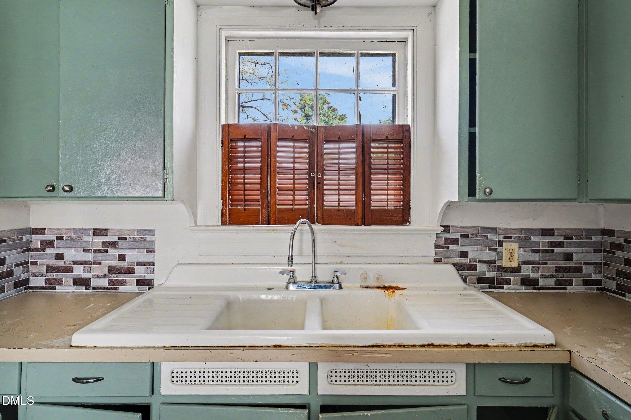 300 Frances Place Kinston, NC 28501 - Photo 13 of 25 a kitchen with granite countertop a sink and a window