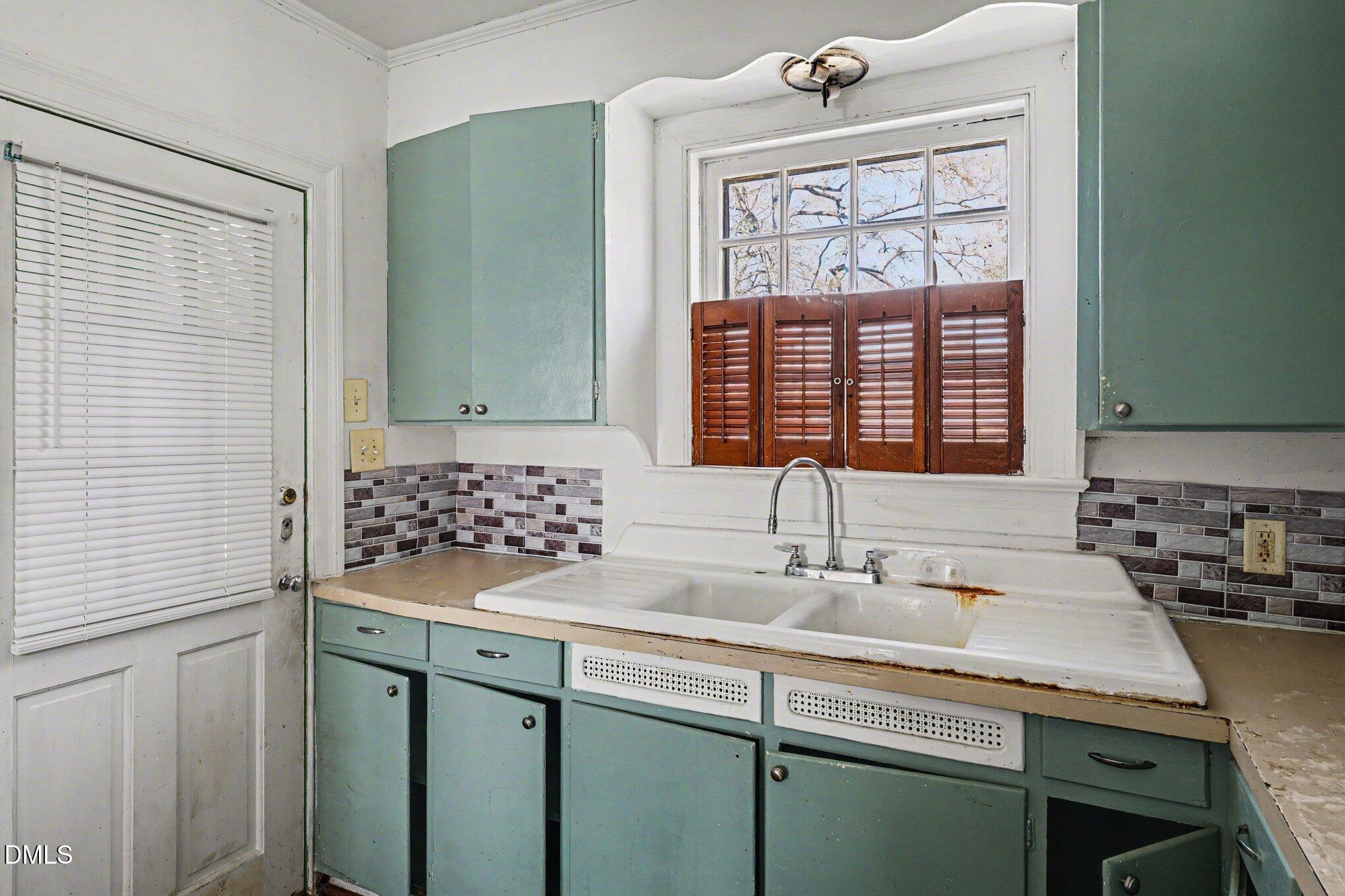 300 Frances Place Kinston, NC 28501 - Photo 14 of 25 a bathroom with a sink and a window