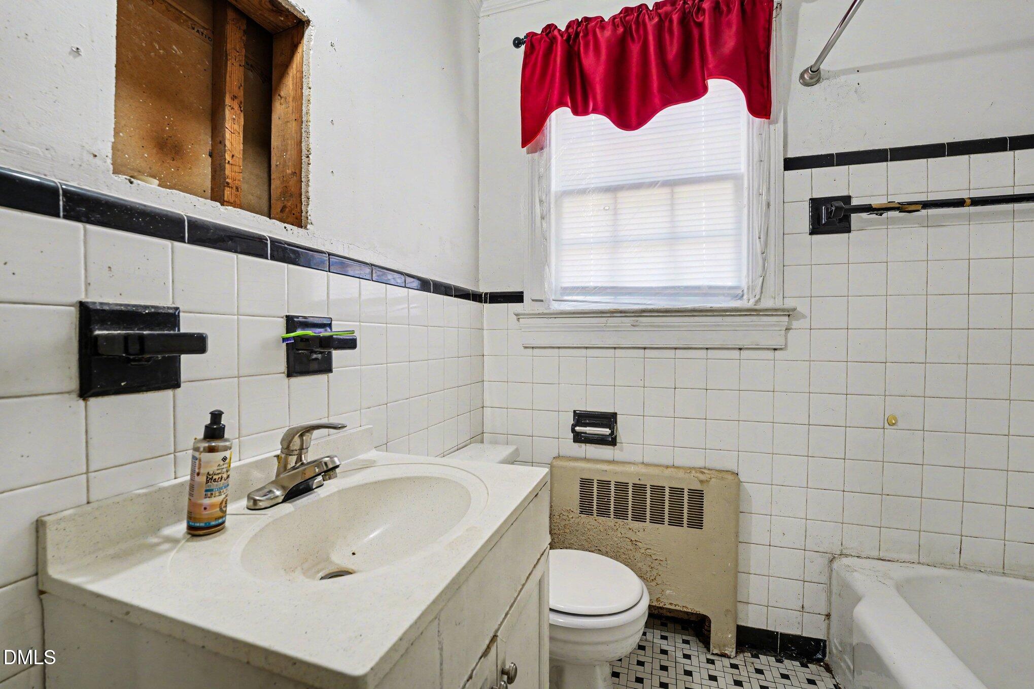 300 Frances Place Kinston, NC 28501 - Photo 15 of 25 a bathroom with a sink toilet and mirror