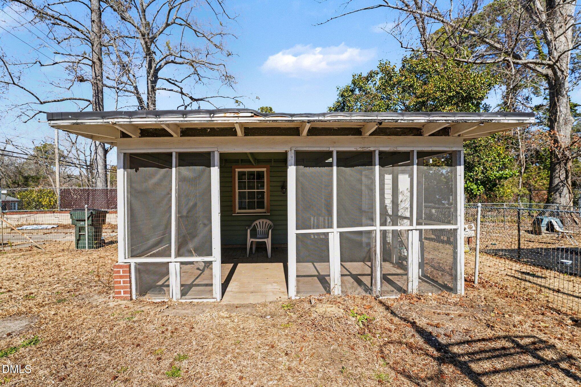 300 Frances Place Kinston, NC 28501 - Photo 23 of 25 a view of a house with a large window and wooden fence