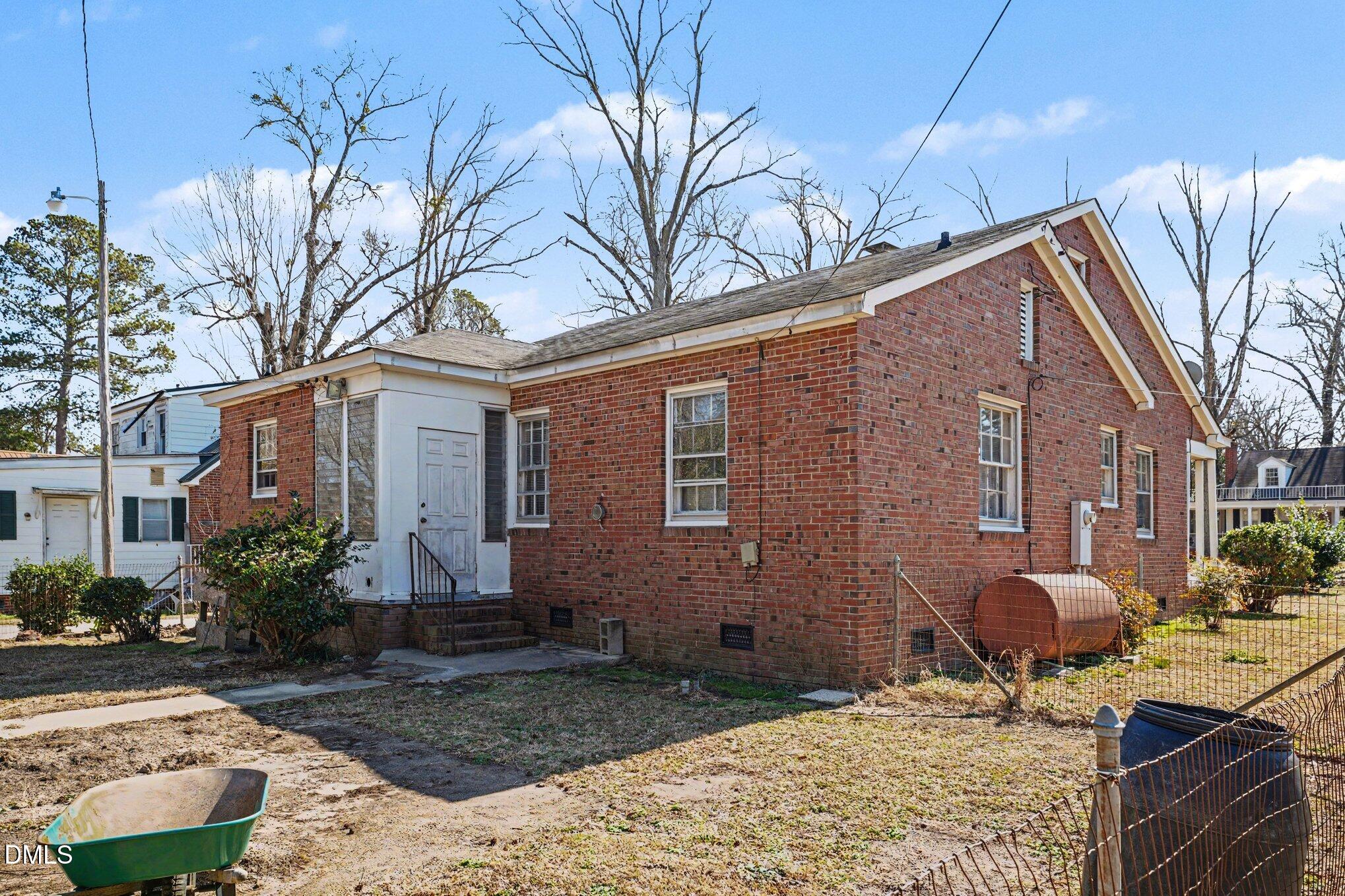 300 Frances Place Kinston, NC 28501 - Photo 25 of 25 a brick building with a large tree