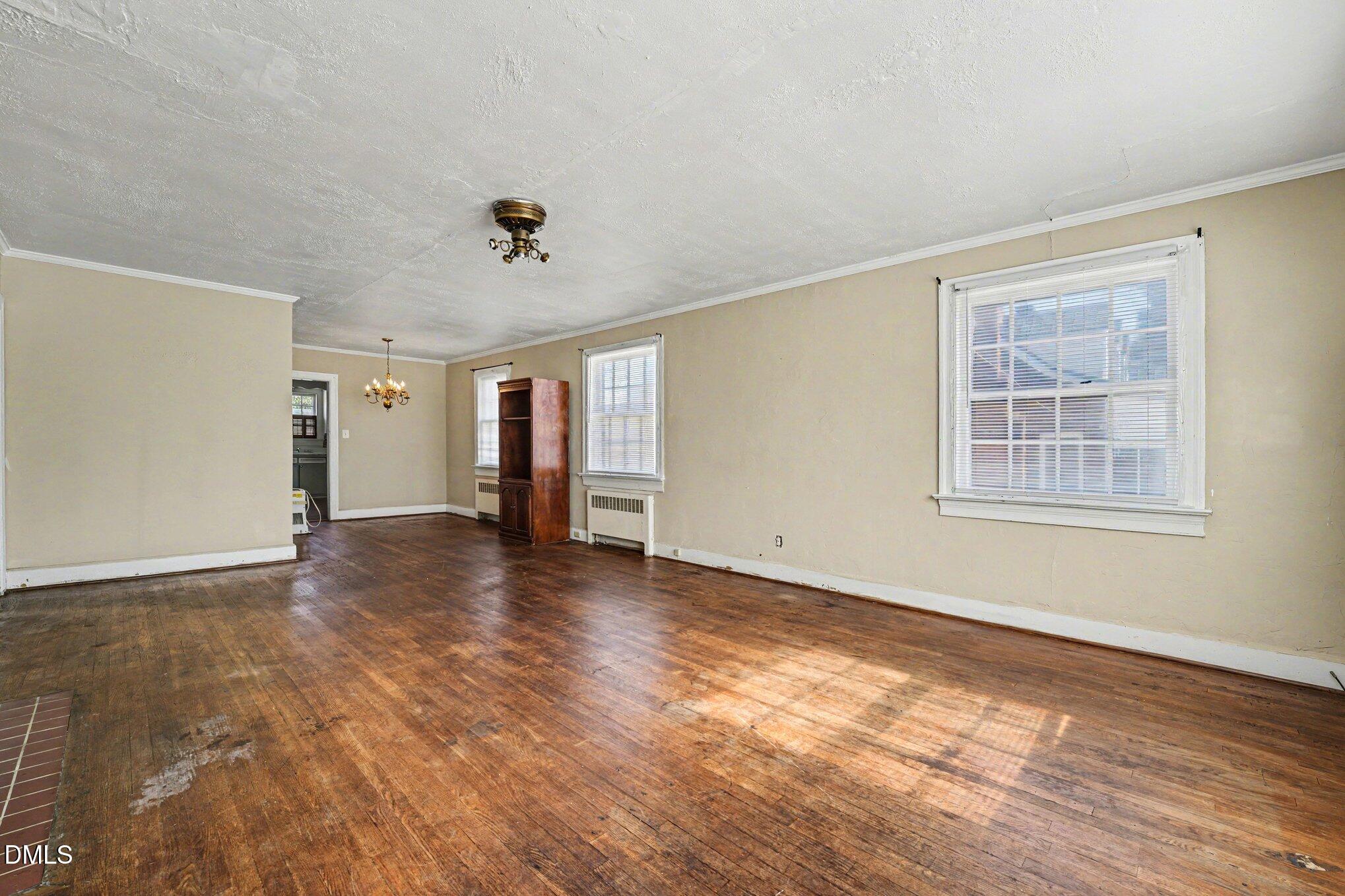 300 Frances Place Kinston, NC 28501 - Photo 6 of 25 a view of an empty room with wooden floor and a window