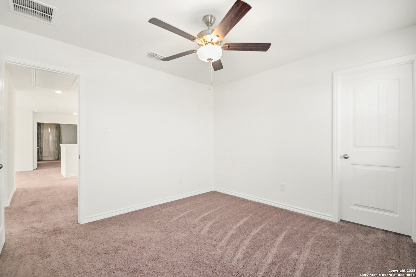 5010 Big Oak Run Elmendorf, TX 78112 - Photo 21 of 31 an empty room with closet and ceiling fan