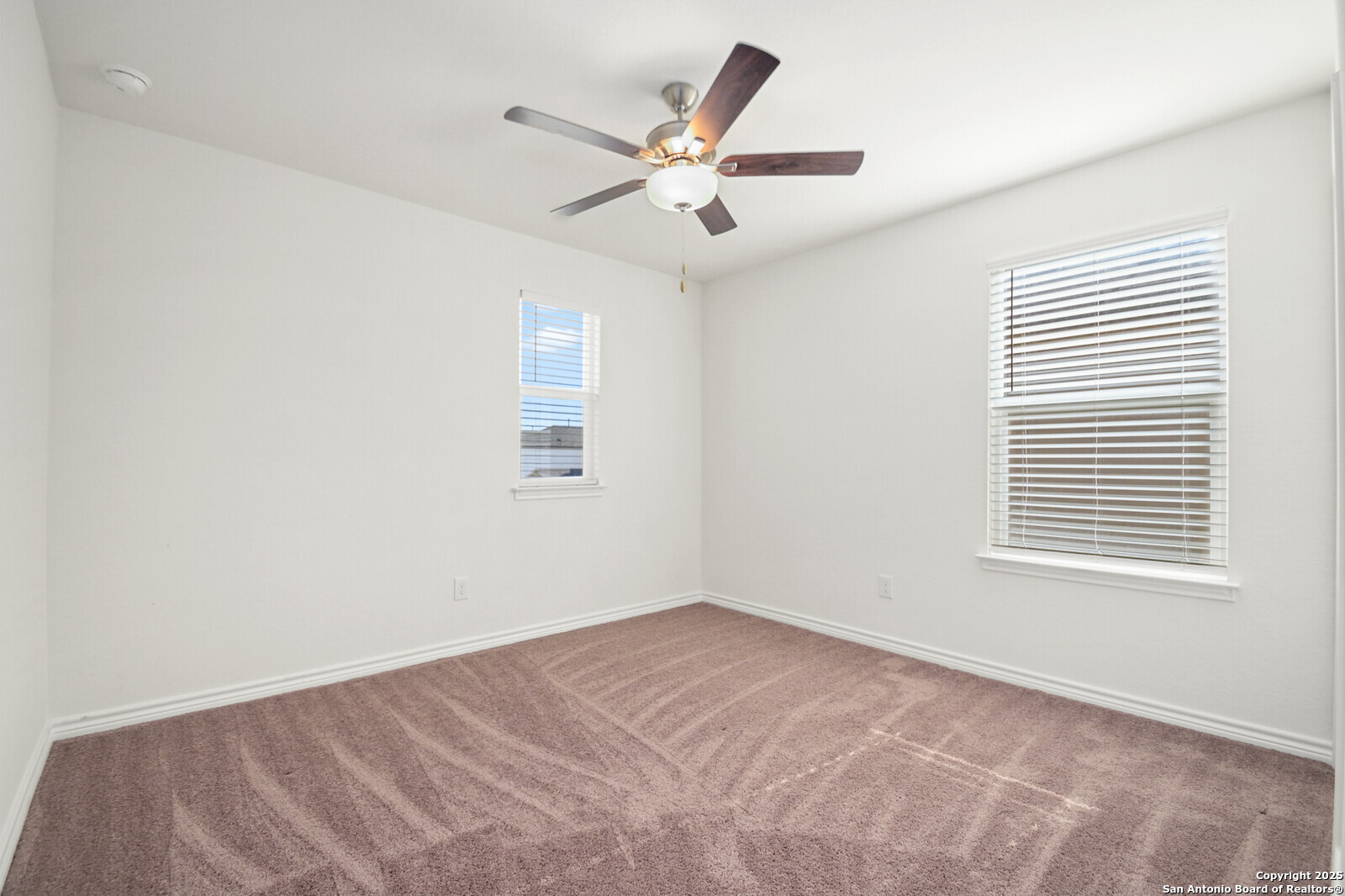 5010 Big Oak Run Elmendorf, TX 78112 - Photo 22 of 31 a view of a livingroom with a ceiling fan and window