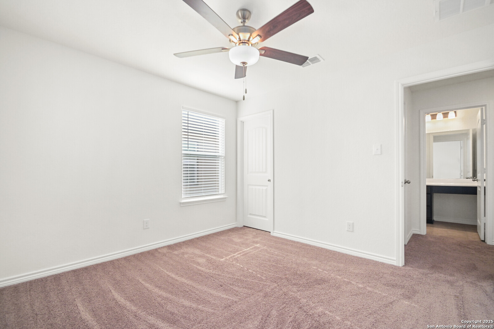 5010 Big Oak Run Elmendorf, TX 78112 - Photo 23 of 31 an empty room with fan and windows