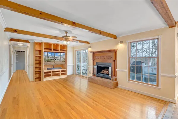 a view of a kitchen with wooden floor and staircase