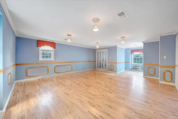 a bathroom with a double vanity sink mirror and shower