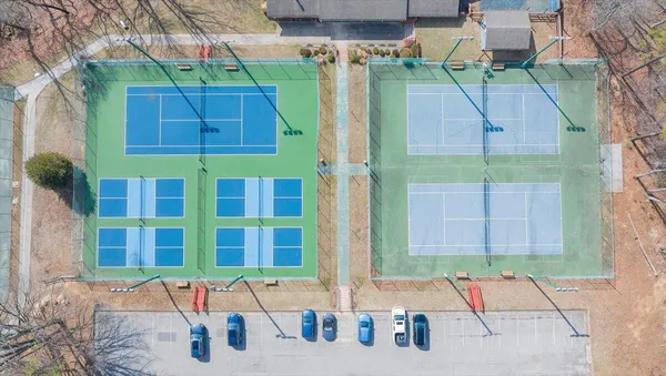 a view of a swimming pool with a yard
