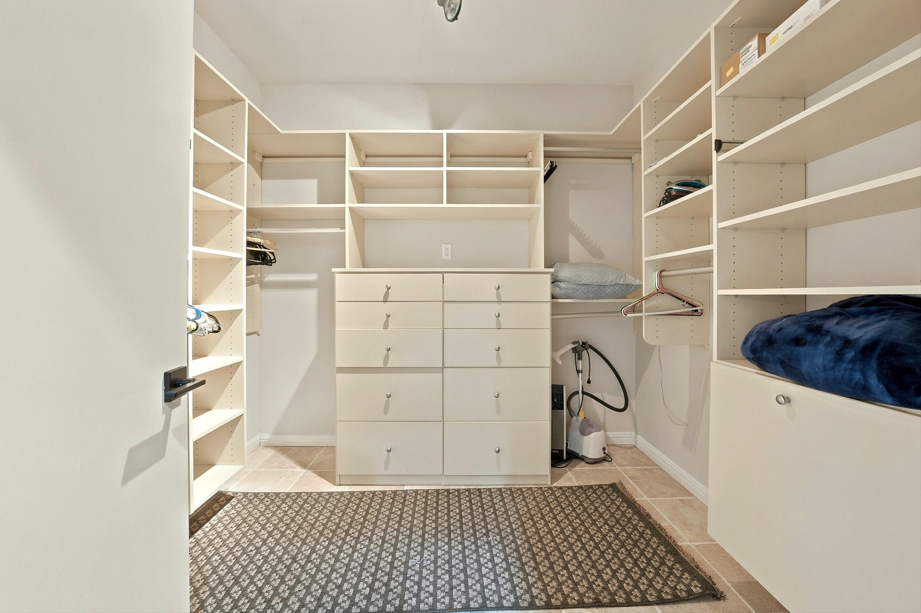 138 Lakeshore Drive Rancho Mirage, CA 92270 - Photo 19 of 30 a view of walk in closet with empty racks