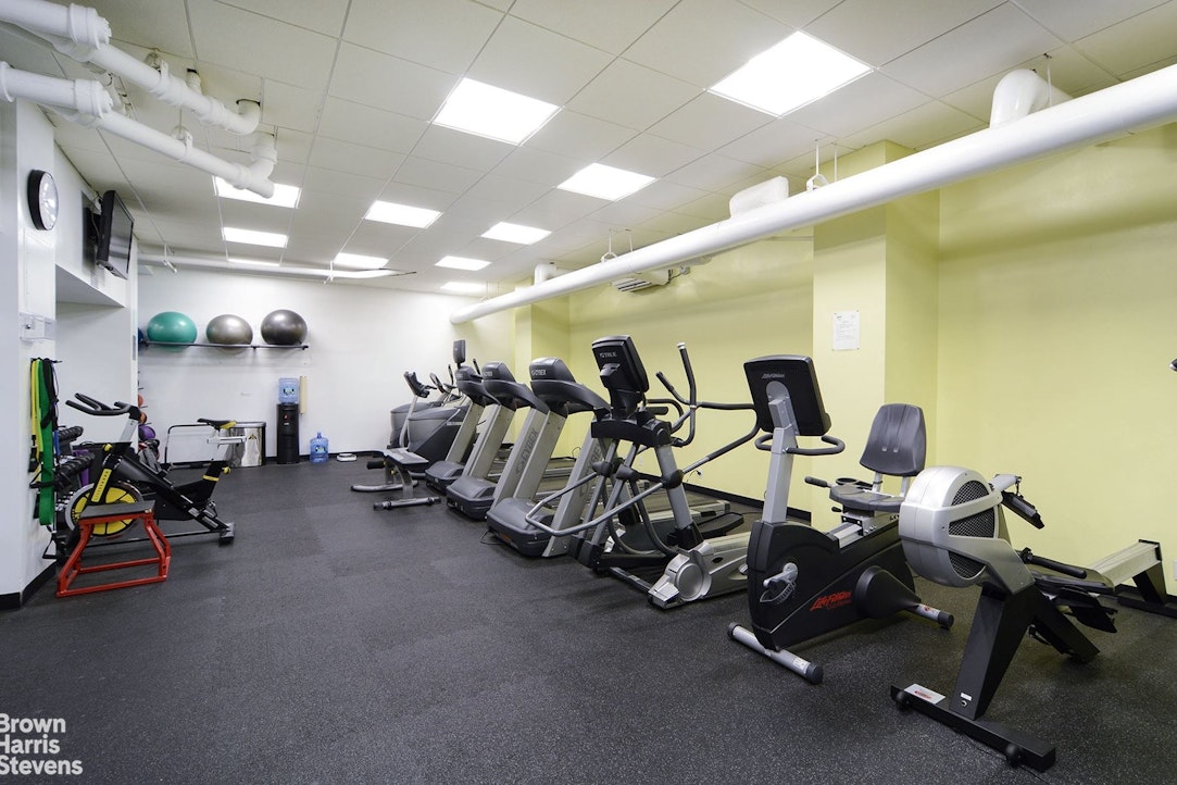 200 East 27th Street, Unit 11L Manhattan, NY 10016 - Photo 9 of 24 a view of a room with gym equipment