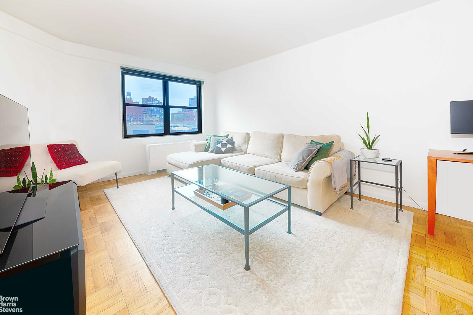 200 East 27th Street, Unit 11L Manhattan, NY 10016 - Photo 12 of 24 a living room with furniture and a window