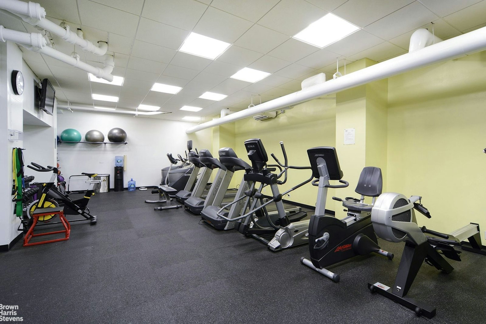 200 East 27th Street, Unit 11L Manhattan, NY 10016 - Photo 17 of 24 a view of a room with gym equipment