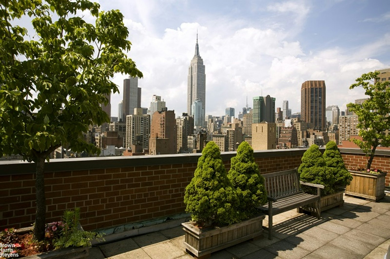 200 East 27th Street, Unit 11L Manhattan, NY 10016 - Photo 18 of 24 a city view with tall buildings and a bench