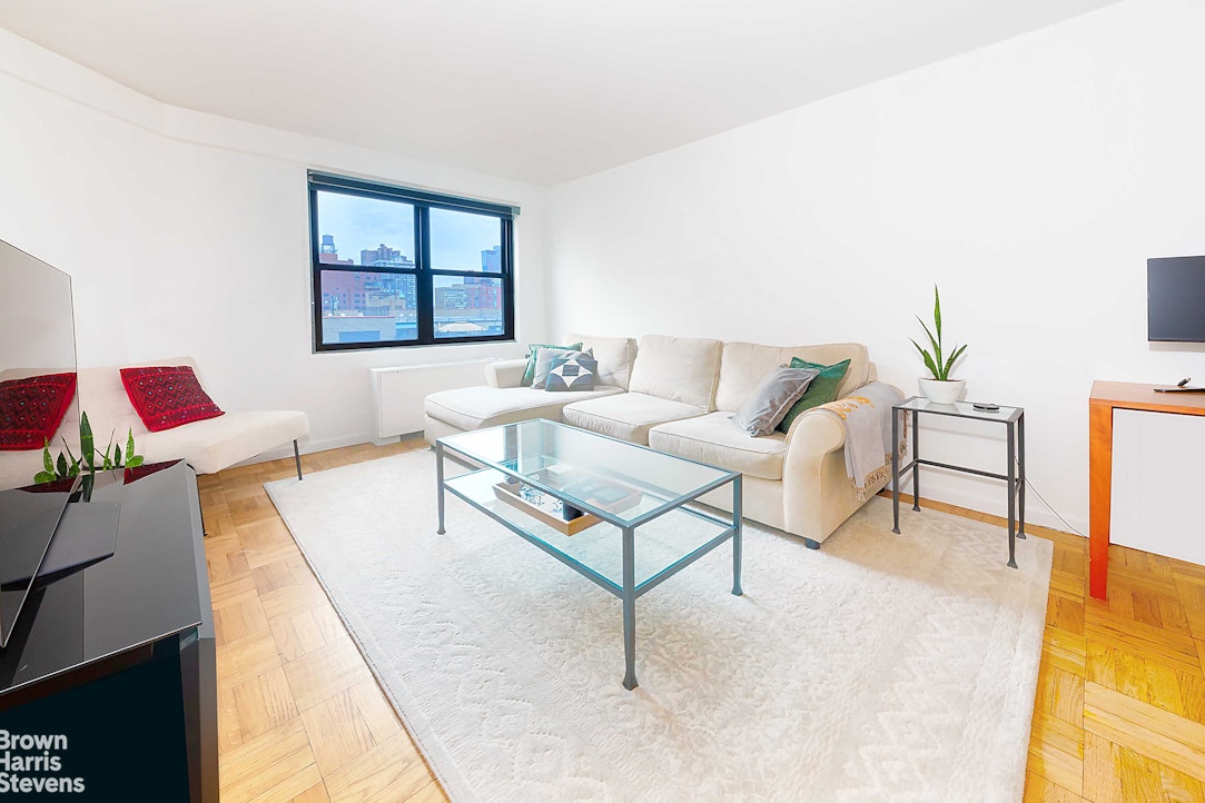 200 East 27th Street, Unit 11L Manhattan, NY 10016 - Photo 2 of 24 a living room with furniture and a window