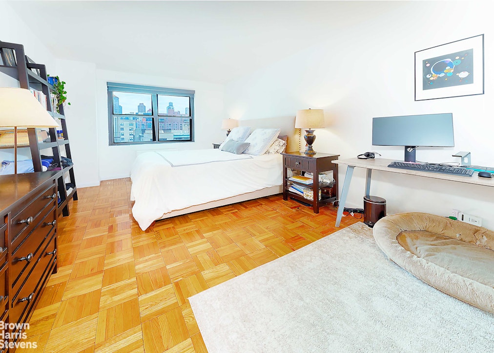 200 East 27th Street, Unit 11L Manhattan, NY 10016 - Photo 5 of 24 a bedroom with a bed and dresser