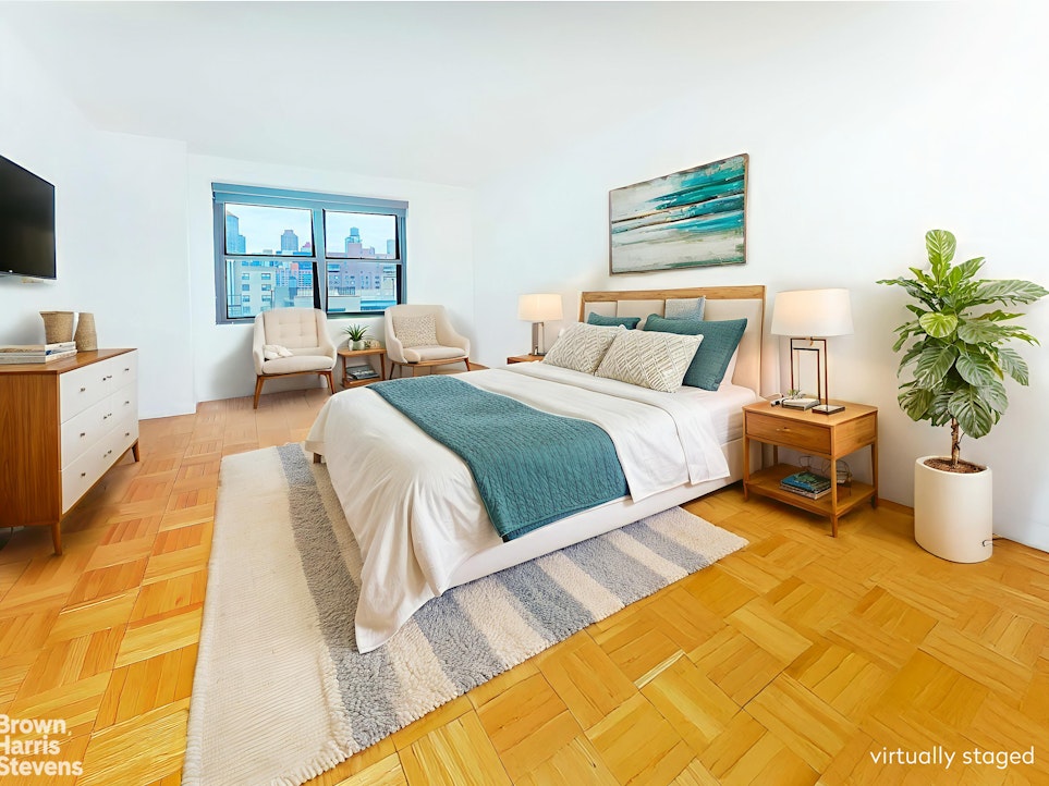 200 East 27th Street, Unit 11L Manhattan, NY 10016 - Photo 6 of 24 a bedroom with a large bed and a couch
