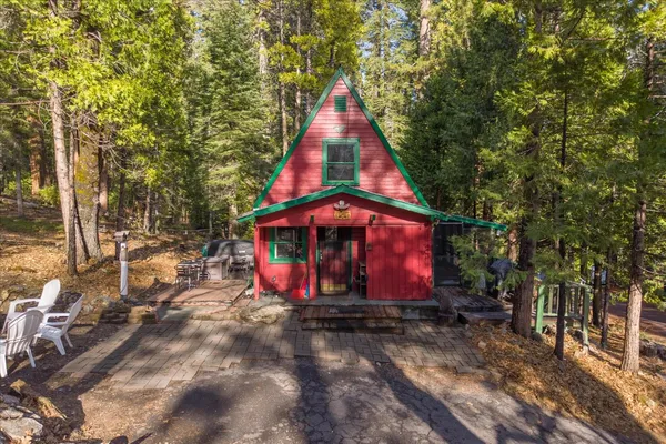 a view of a backyard with chairs