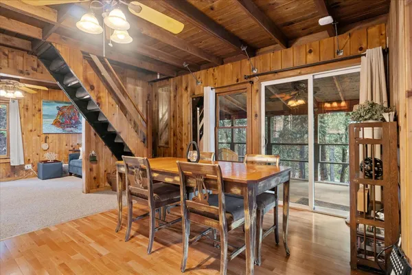 a living room with furniture a fireplace and a large window