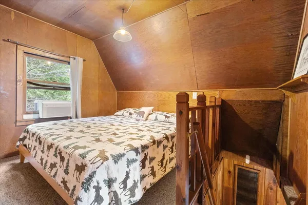 a view of a porch with a floor to ceiling window with wooden floor