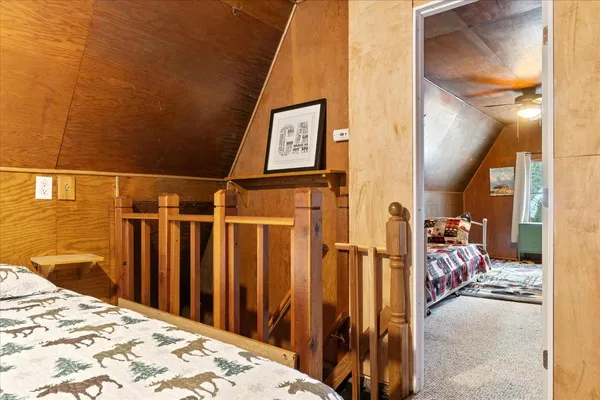 a view of a porch with furniture and a yard