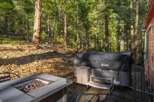 a view of a house with a backyard