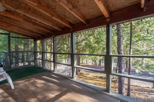 a backyard of a house with outdoor seating