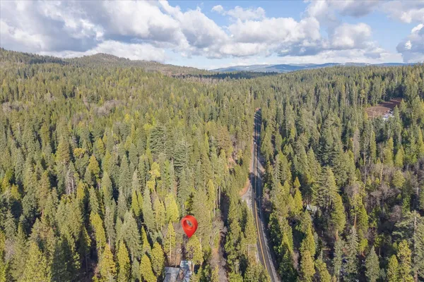a view of house with outdoor seating