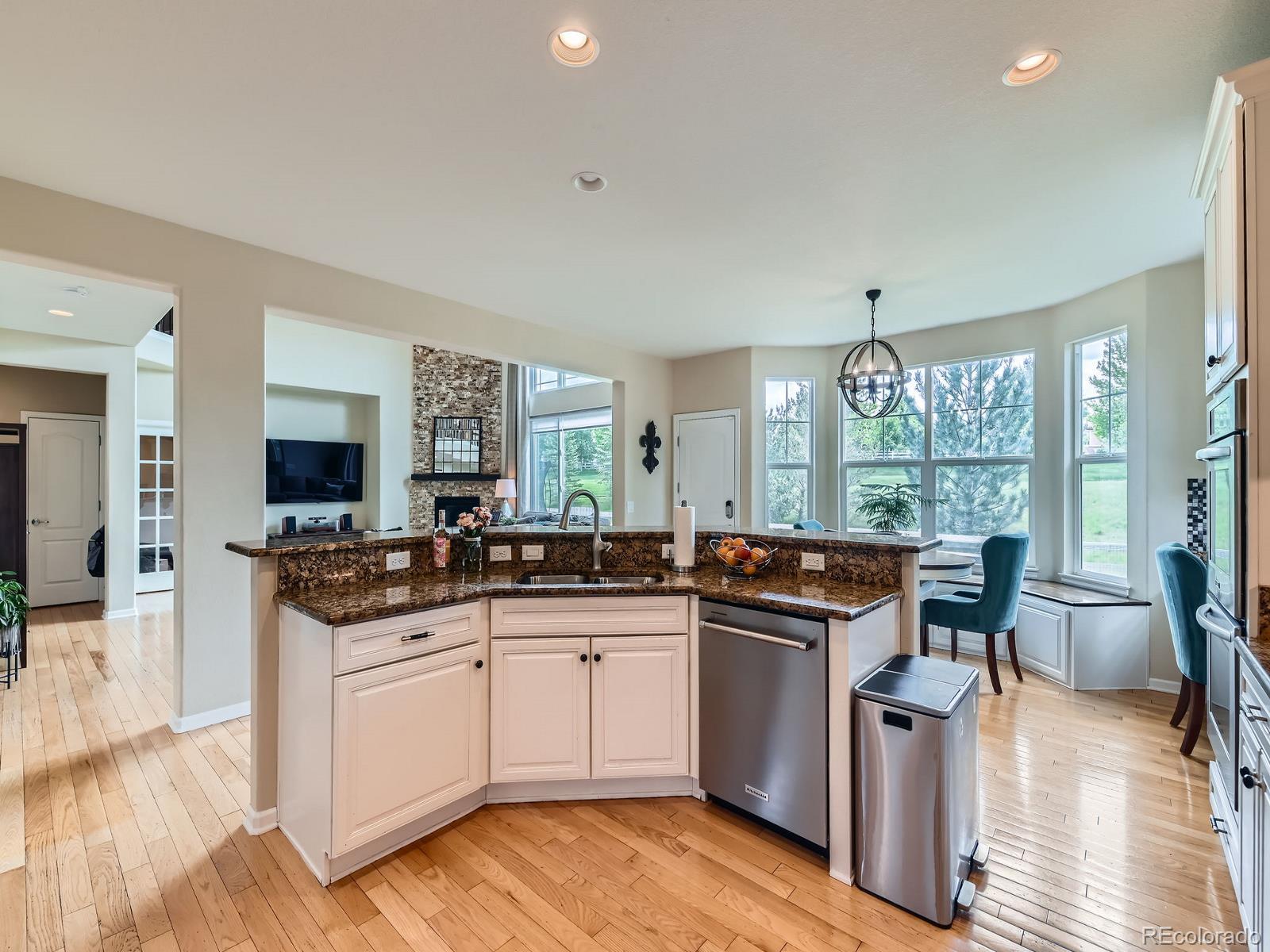 2896 Gemini Loop Broomfield, CO 80023 - Photo 12 of 49 a kitchen with granite countertop a sink and cabinets