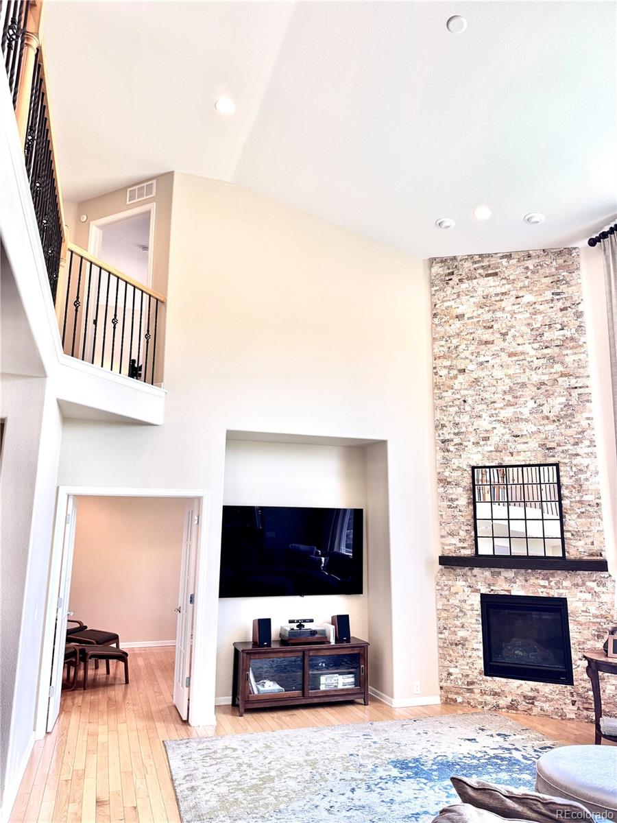 2896 Gemini Loop Broomfield, CO 80023 - Photo 14 of 49 a living room with furniture and a flat screen tv