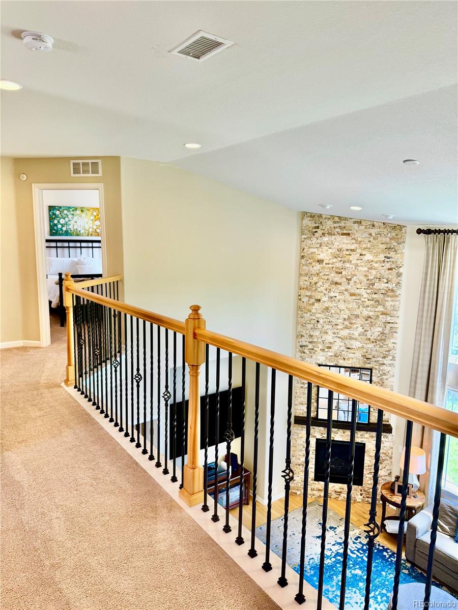 2896 Gemini Loop Broomfield, CO 80023 - Photo 18 of 49 a view of a porch with wooden floor and windows
