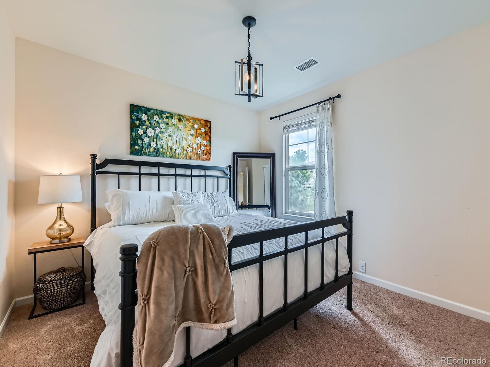2896 Gemini Loop Broomfield, CO 80023 - Photo 23 of 49 a bedroom with furniture and a window