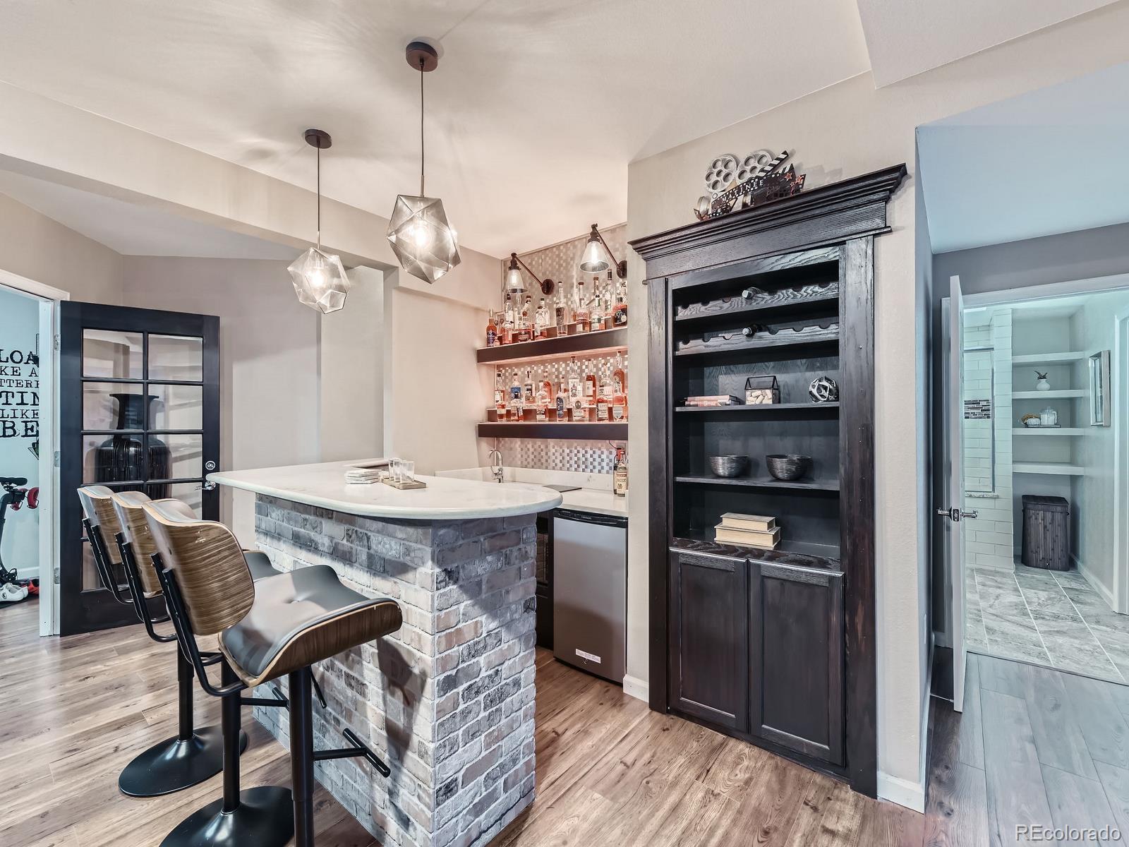 2896 Gemini Loop Broomfield, CO 80023 - Photo 32 of 49 a view of a dining room with furniture and wooden floor