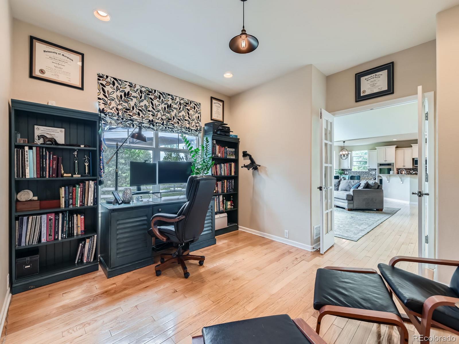 2896 Gemini Loop Broomfield, CO 80023 - Photo 5 of 49 a view of a livingroom with furniture and a bookshelf