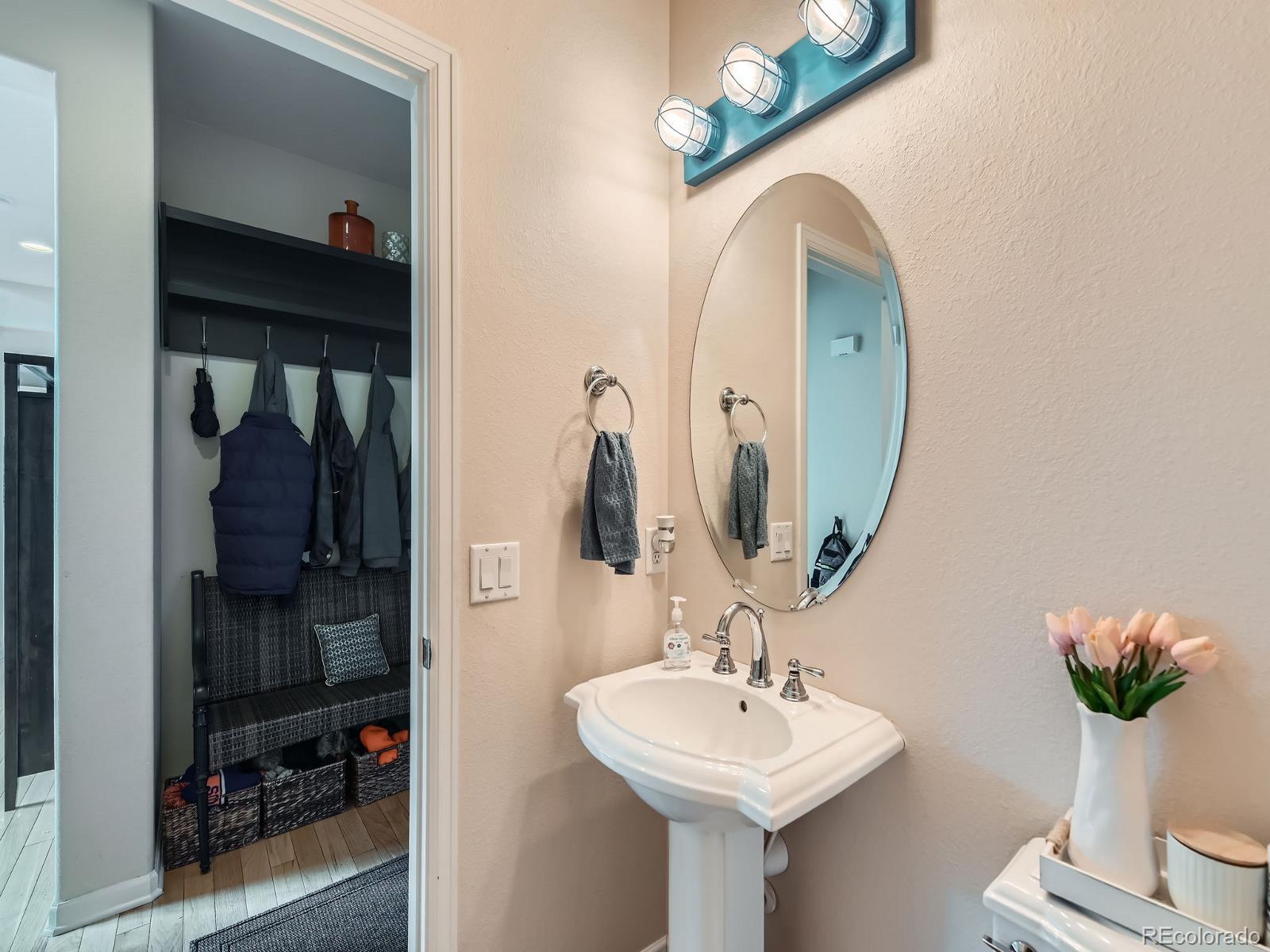 2896 Gemini Loop Broomfield, CO 80023 - Photo 6 of 49 a bathroom with a sink and a mirror