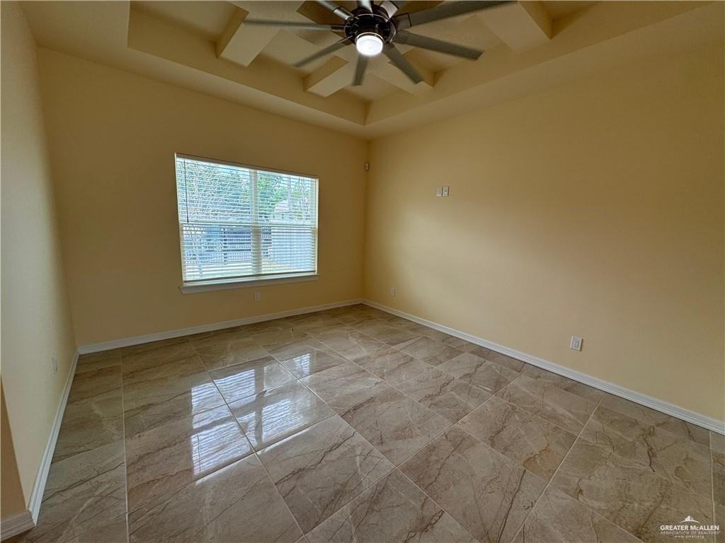 1114 North 20th Street McAllen, TX 78501 - Photo 21 of 27 an empty room with windows and fan