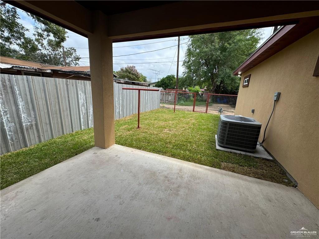 1114 North 20th Street McAllen, TX 78501 - Photo 27 of 27 a view of backyard with wooden fence and a large window