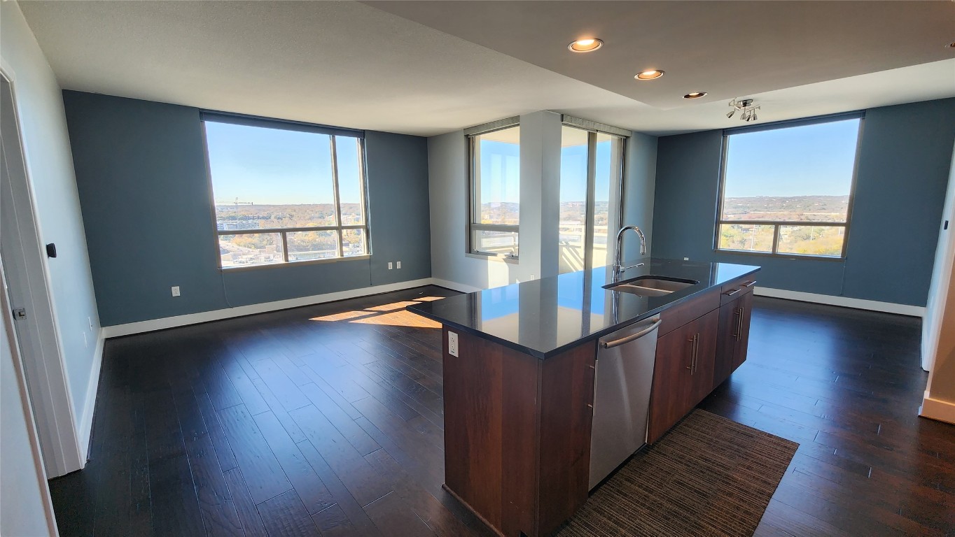 300 Bowie Street, Unit 1305 Austin, TX 78703 - Photo 36 of 38 a living room with couches and wooden floor