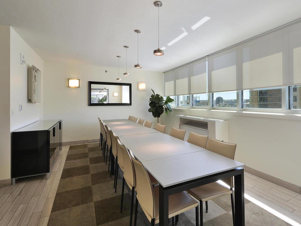 300 Bowie Street, Unit 1305 Austin, TX 78703 - Photo 26 of 38 a kitchen with a table and chairs in it